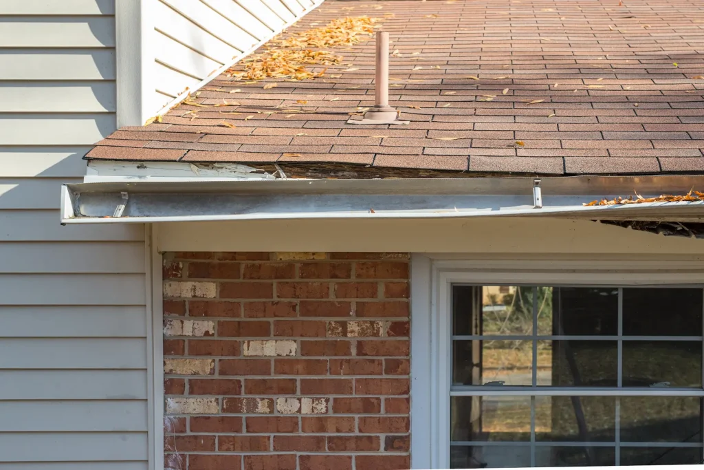 old broken rain gutters on a house.