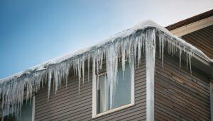 dangerous icicles on roof winter home ice damage residential building maintenance neglect ice stalactites