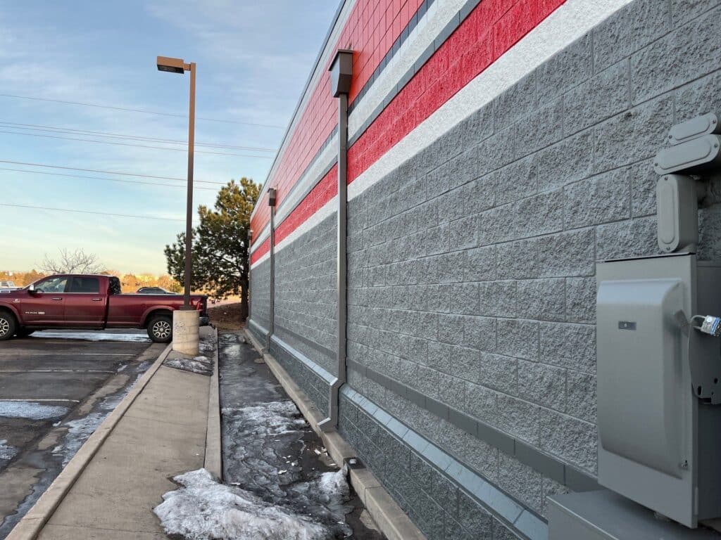 commercial box gutters and downspout on side of autozone