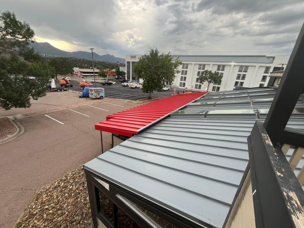 new metal roof on restaurant with red and gray panels